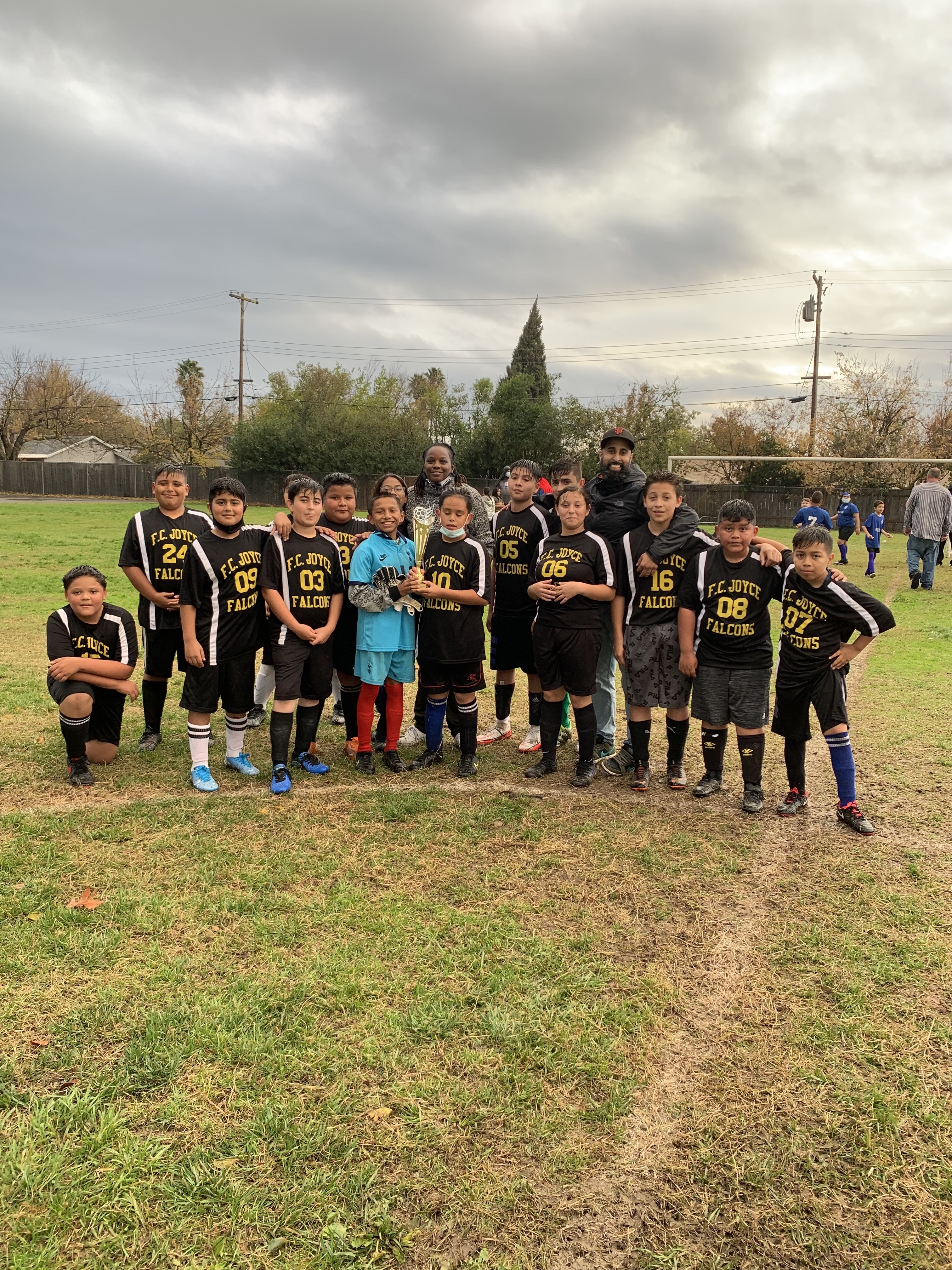 soccer players posing for pictures
